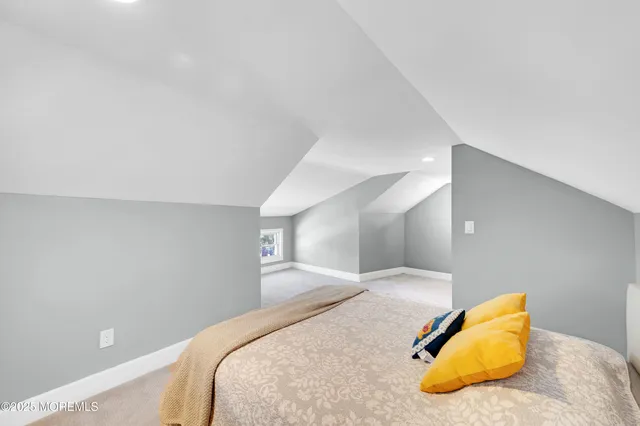 a bedroom with a bed and a lamp