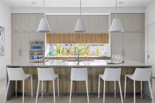 a kitchen with a table and chairs in it