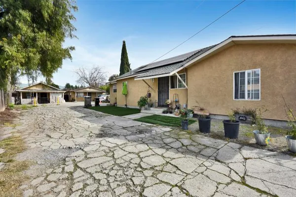 a front view of a house with backyard