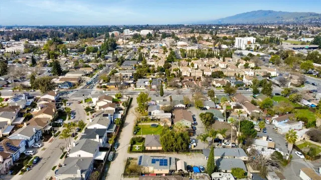 an aerial view of residential houses and outdoor space