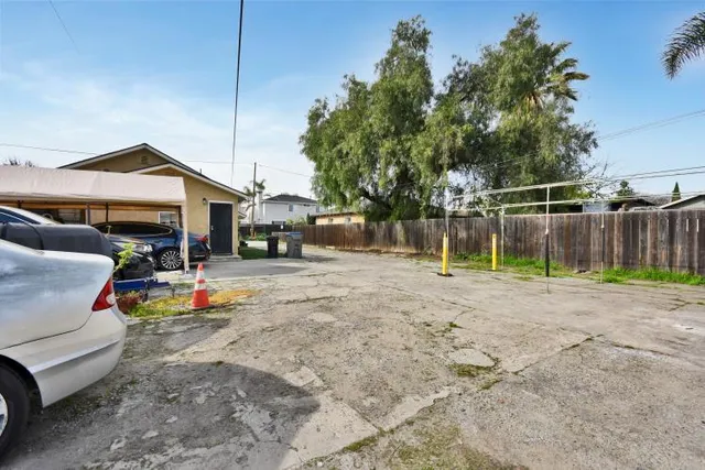 a view of backyard with small play house