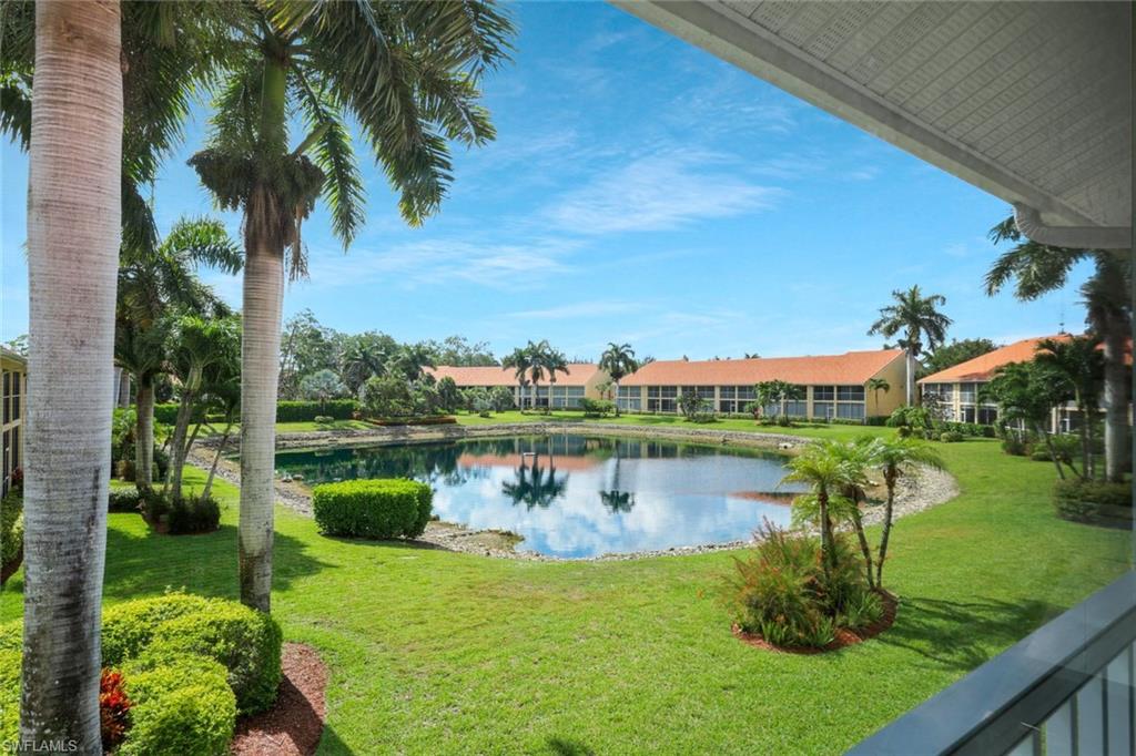 2395 Bayou Lane, Unit 7304 Naples, FL 34112 - Photo 26 of 27 LAKE VIEW FROM THE LANAI