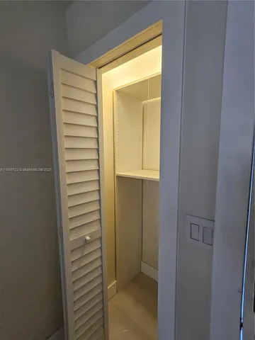 a kitchen with stainless steel appliances granite countertop a refrigerator stove microwave and sink