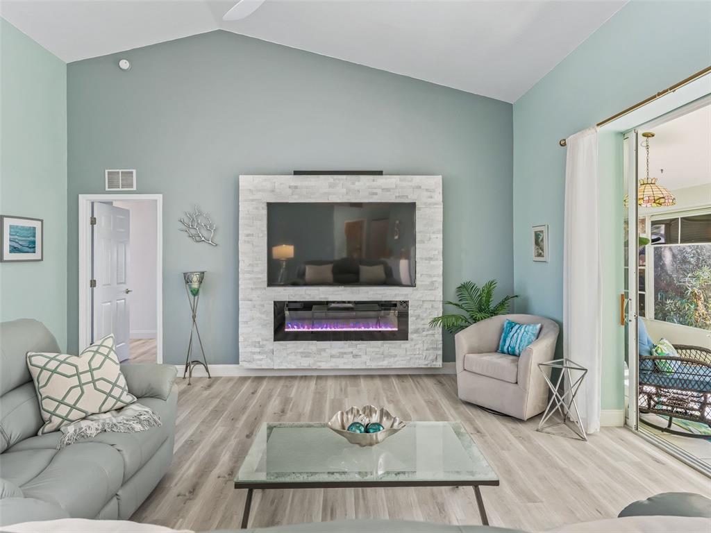 5016 Northwest 18th Street Ocala, FL 34482 - Photo 11 of 40 a living room with furniture and a fireplace