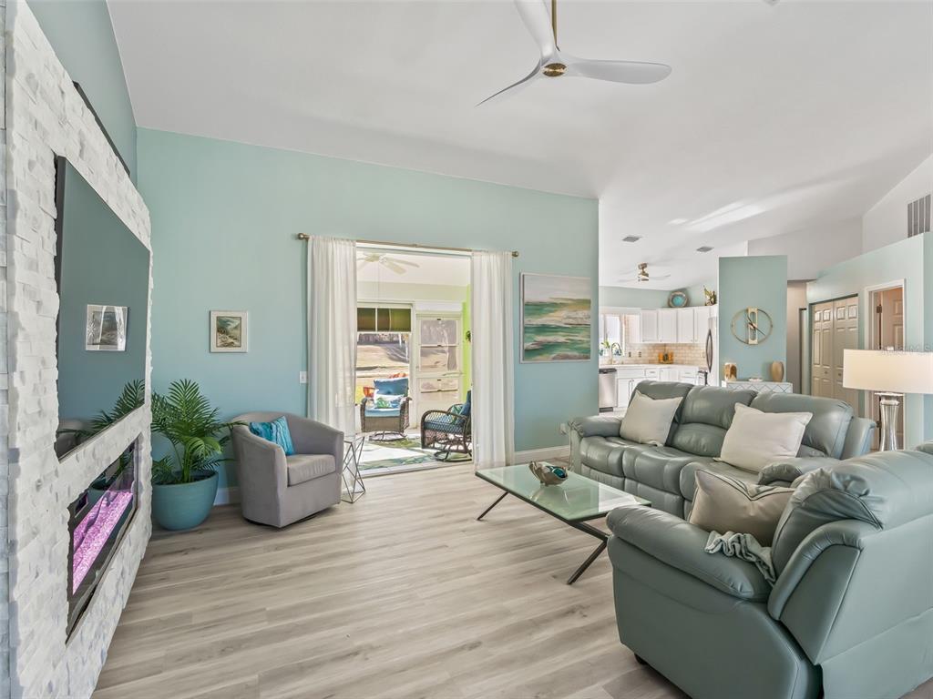 5016 Northwest 18th Street Ocala, FL 34482 - Photo 12 of 40 a living room with furniture and a flat screen tv