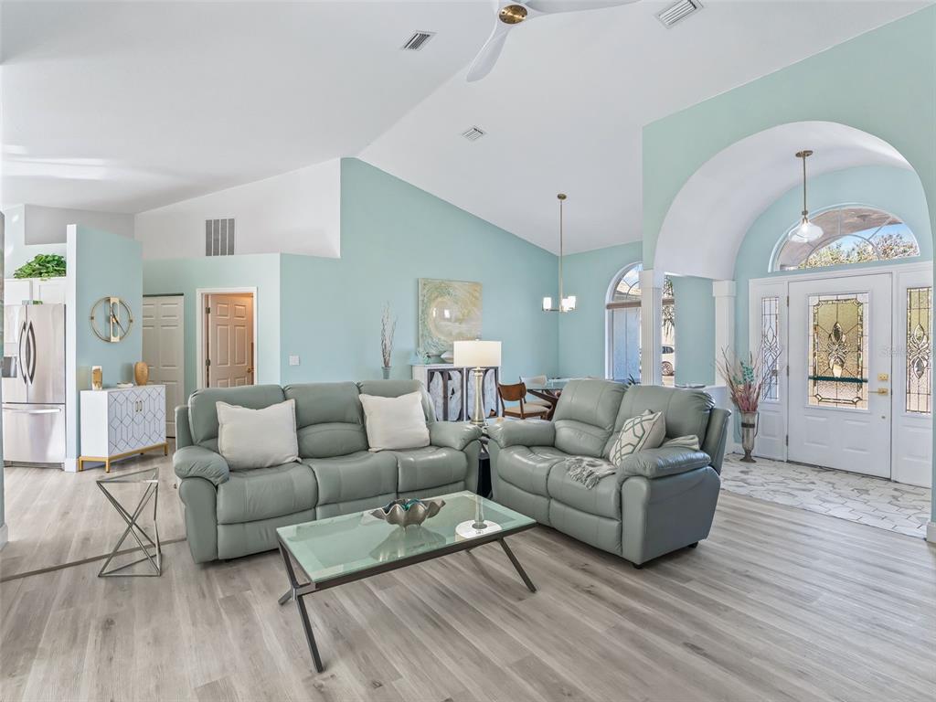 5016 Northwest 18th Street Ocala, FL 34482 - Photo 13 of 40 a living room with furniture and a wooden floor
