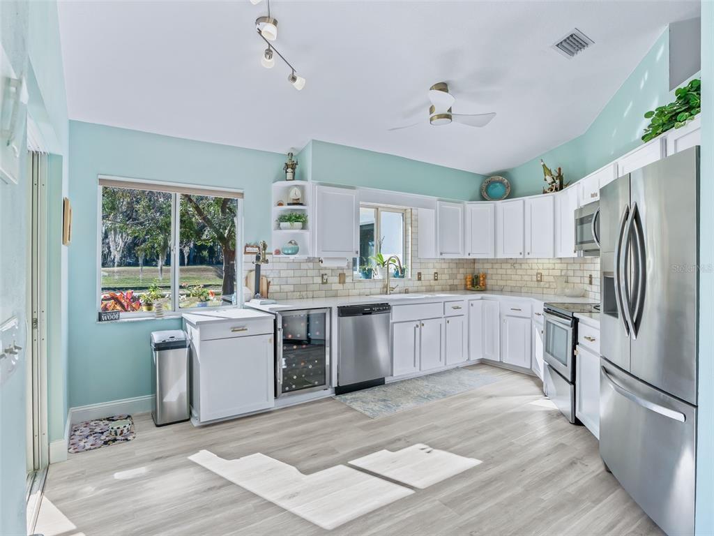 5016 Northwest 18th Street Ocala, FL 34482 - Photo 17 of 40 a kitchen with a refrigerator sink and stove