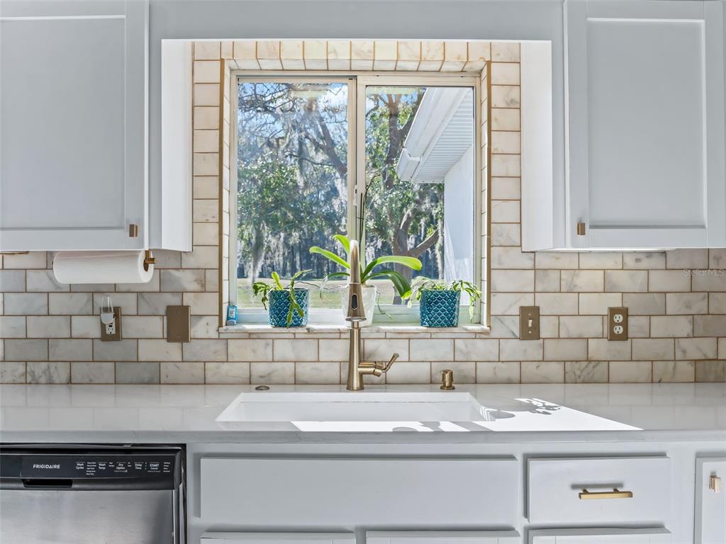 5016 Northwest 18th Street Ocala, FL 34482 - Photo 19 of 40 a kitchen with a sink and cabinets