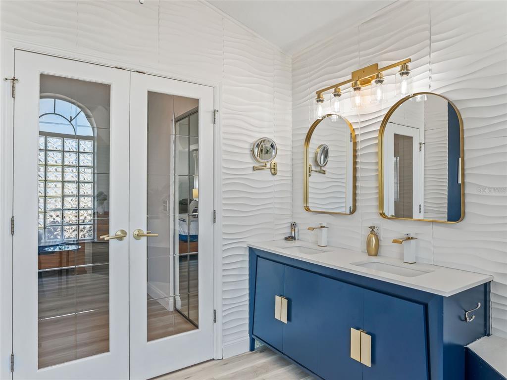 5016 Northwest 18th Street Ocala, FL 34482 - Photo 24 of 40 a bathroom with double vanity sinks and a shower