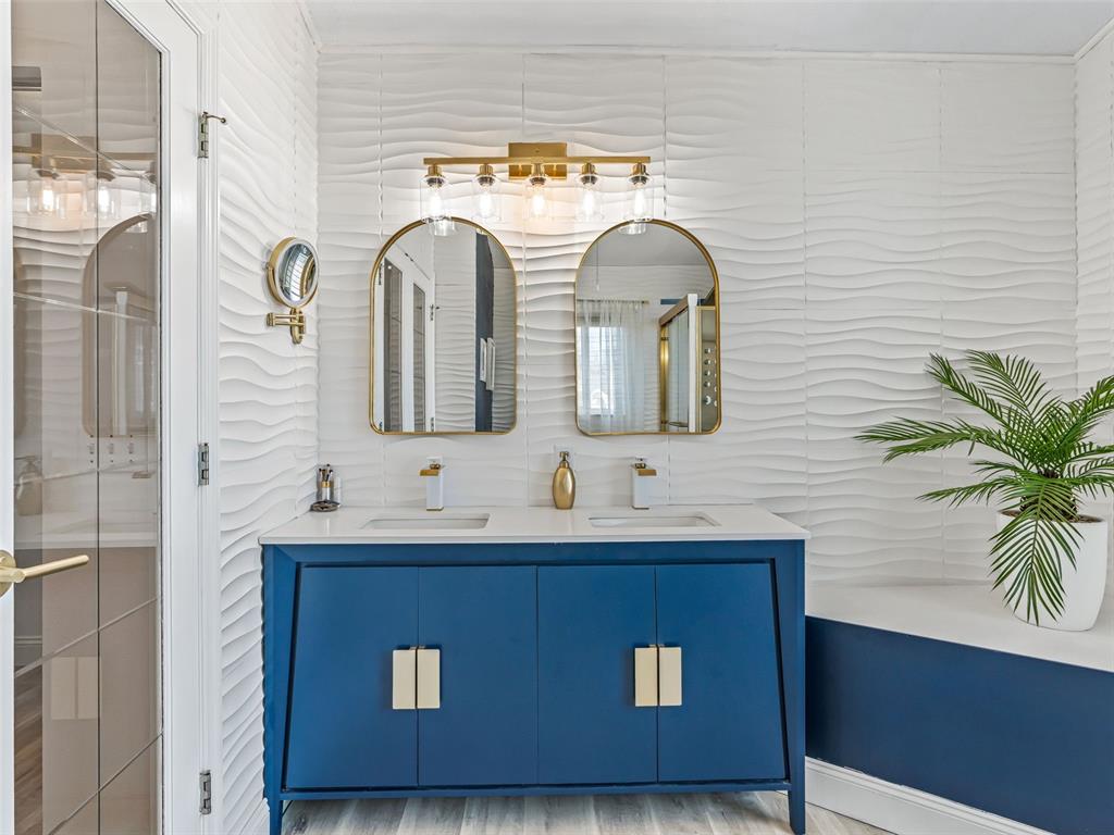 5016 Northwest 18th Street Ocala, FL 34482 - Photo 25 of 40 a bathroom with mirror two sink and a mirror
