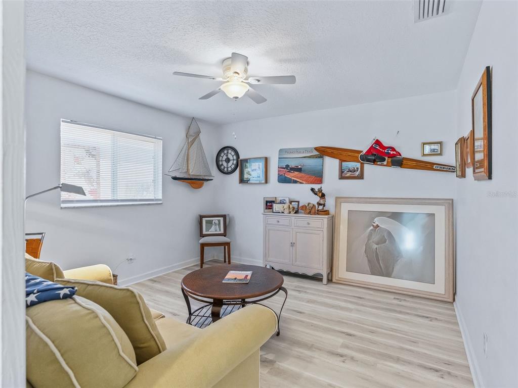 5016 Northwest 18th Street Ocala, FL 34482 - Photo 27 of 40 a living room with furniture and a fireplace