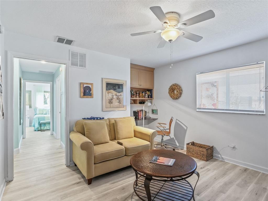 5016 Northwest 18th Street Ocala, FL 34482 - Photo 28 of 40 a living room with furniture and a wooden floor