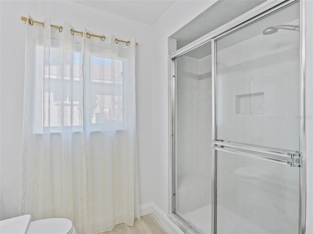 5016 Northwest 18th Street Ocala, FL 34482 - Photo 30 of 40 a bathroom with a shower and a toilet