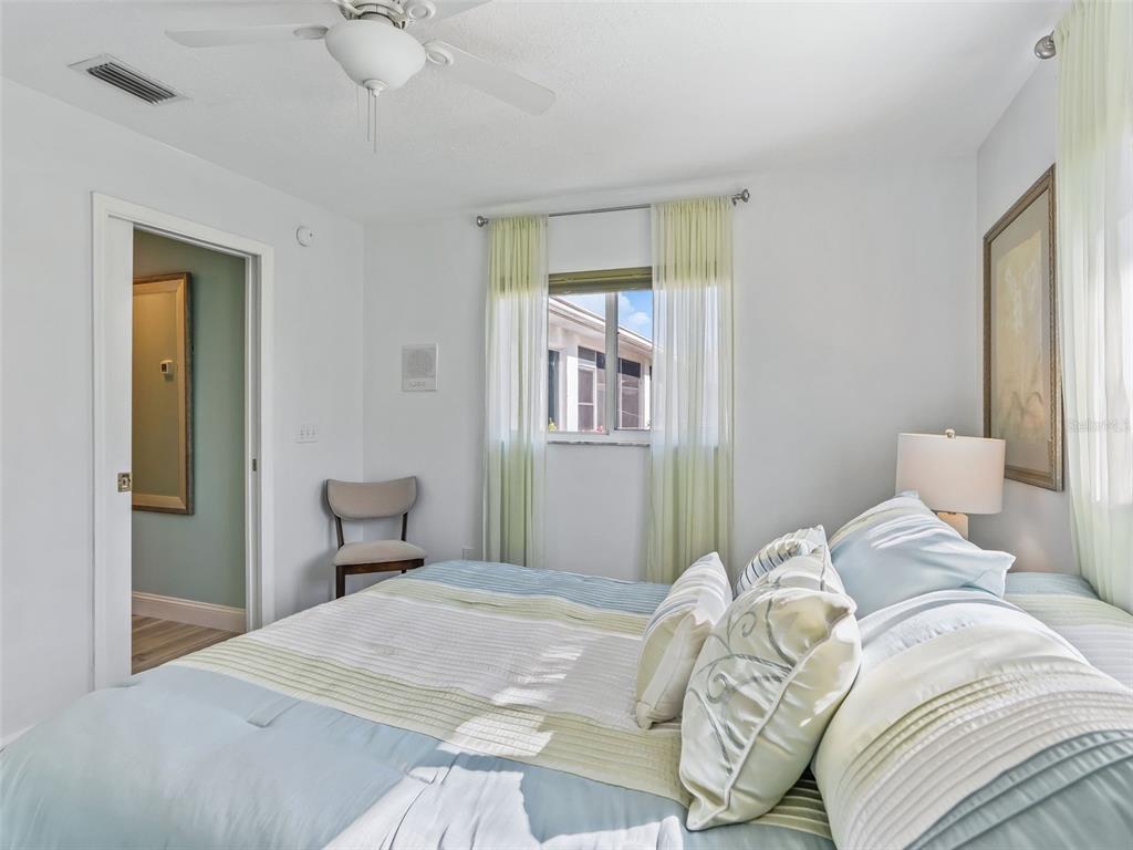 5016 Northwest 18th Street Ocala, FL 34482 - Photo 32 of 40 a bedroom with a bed and a chandelier