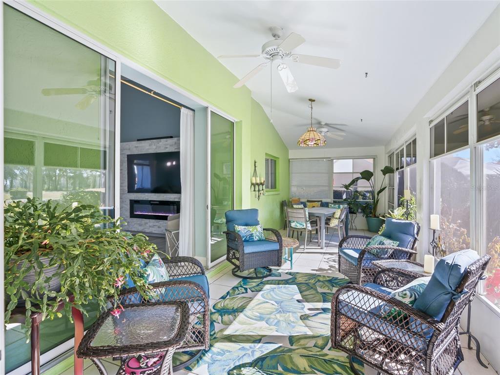 5016 Northwest 18th Street Ocala, FL 34482 - Photo 34 of 40 a living room with patio furniture and a potted plant