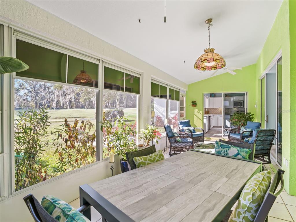 5016 Northwest 18th Street Ocala, FL 34482 - Photo 37 of 40 a view of a dining room with furniture wooden floor and chandelier