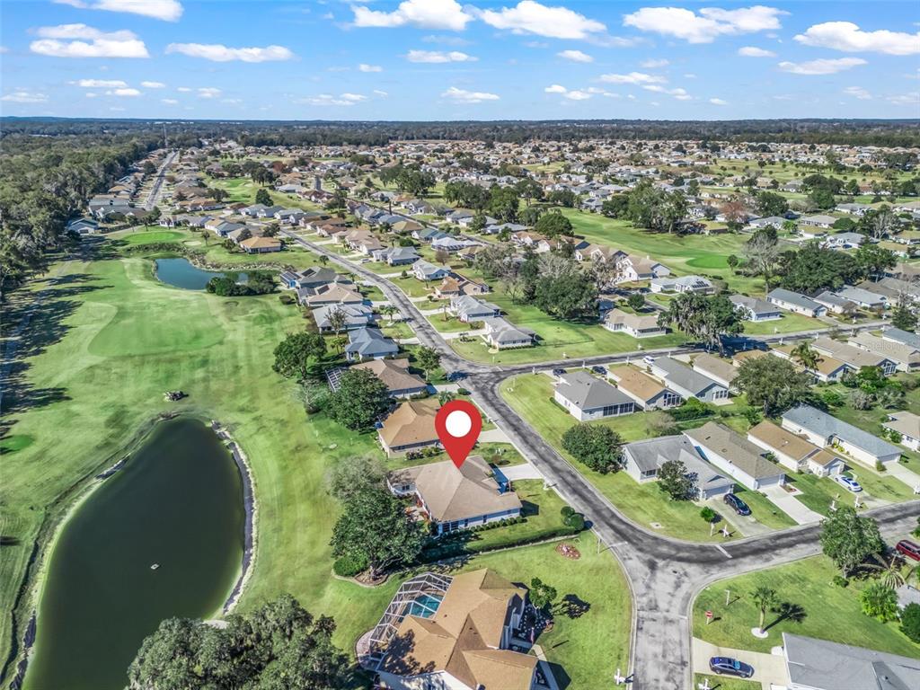5016 Northwest 18th Street Ocala, FL 34482 - Photo 39 of 40 an aerial view of residential houses with outdoor space and lake view