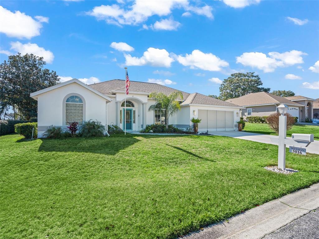 5016 Northwest 18th Street Ocala, FL 34482 - Photo 8 of 40 a front view of a house with a yard