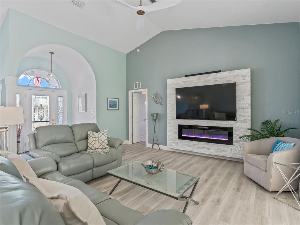 5016 Northwest 18th Street Ocala, FL 34482 - Photo 10 of 40 a living room with furniture and a flat screen tv