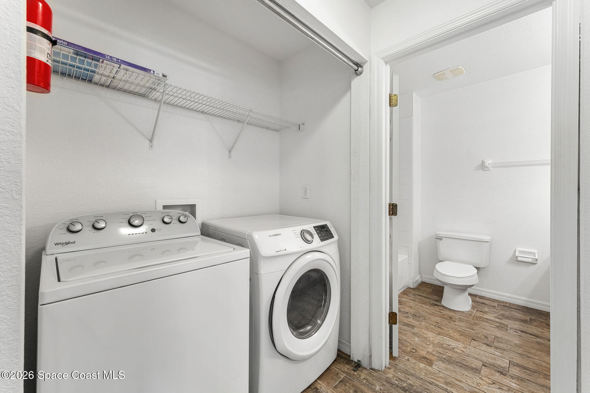 110 Turpial Way, Unit 102 Melbourne, FL 32901 - Photo 12 of 23 a utility room with dryer and washer