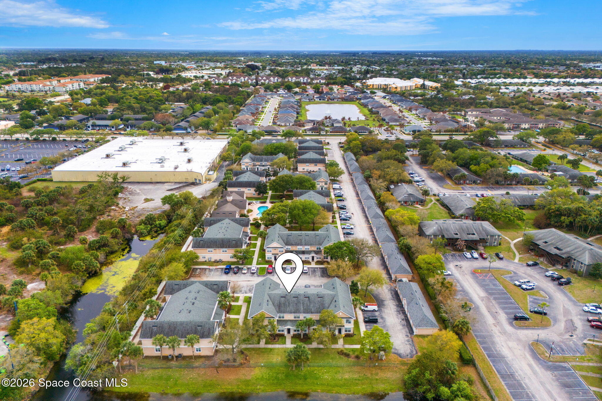 110 Turpial Way, Unit 102 Melbourne, FL 32901 - Photo 13 of 23 an aerial view of residential houses with outdoor space