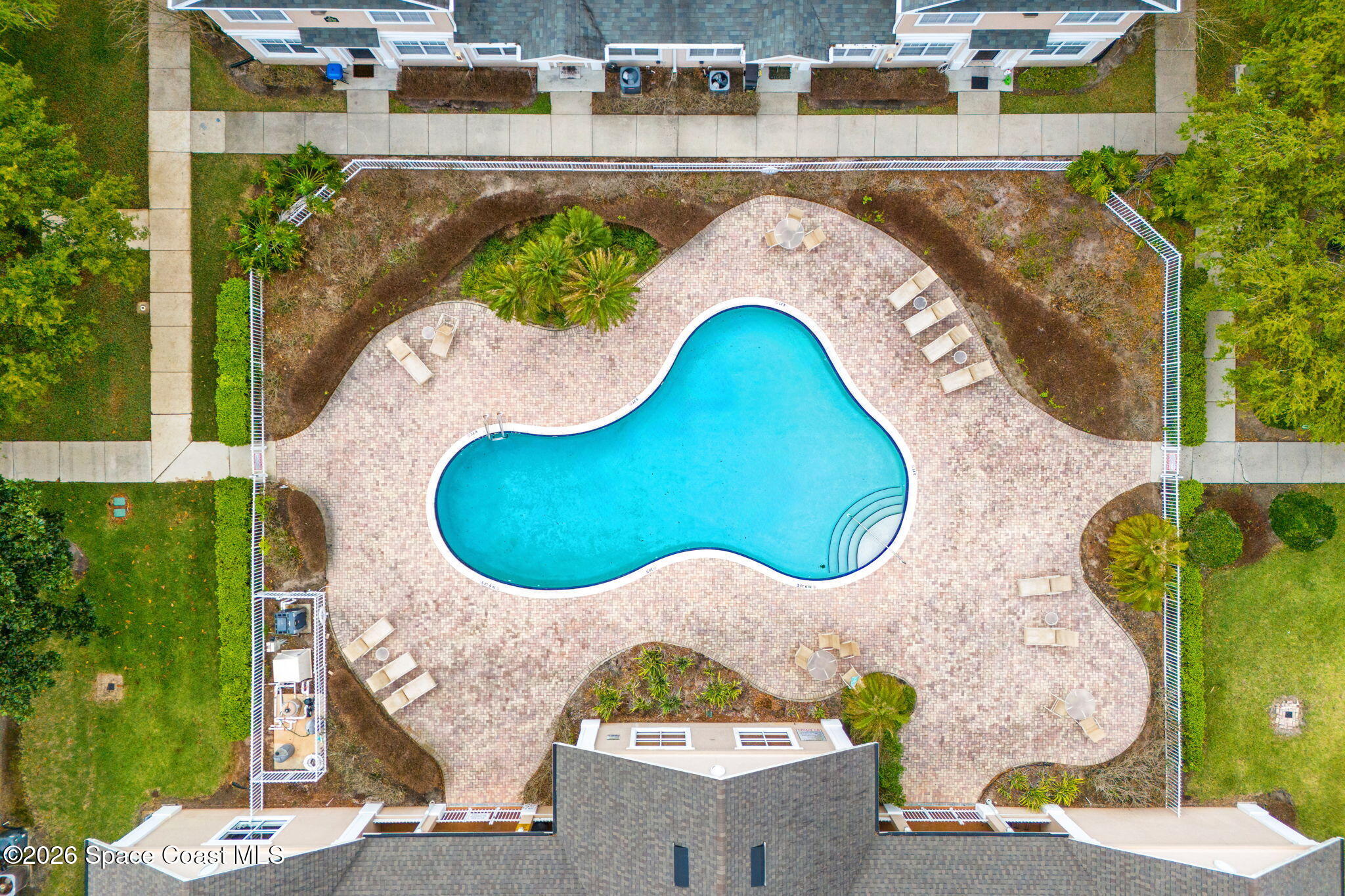 110 Turpial Way, Unit 102 Melbourne, FL 32901 - Photo 16 of 23 an aerial view of a house with swimming pool and outdoor space