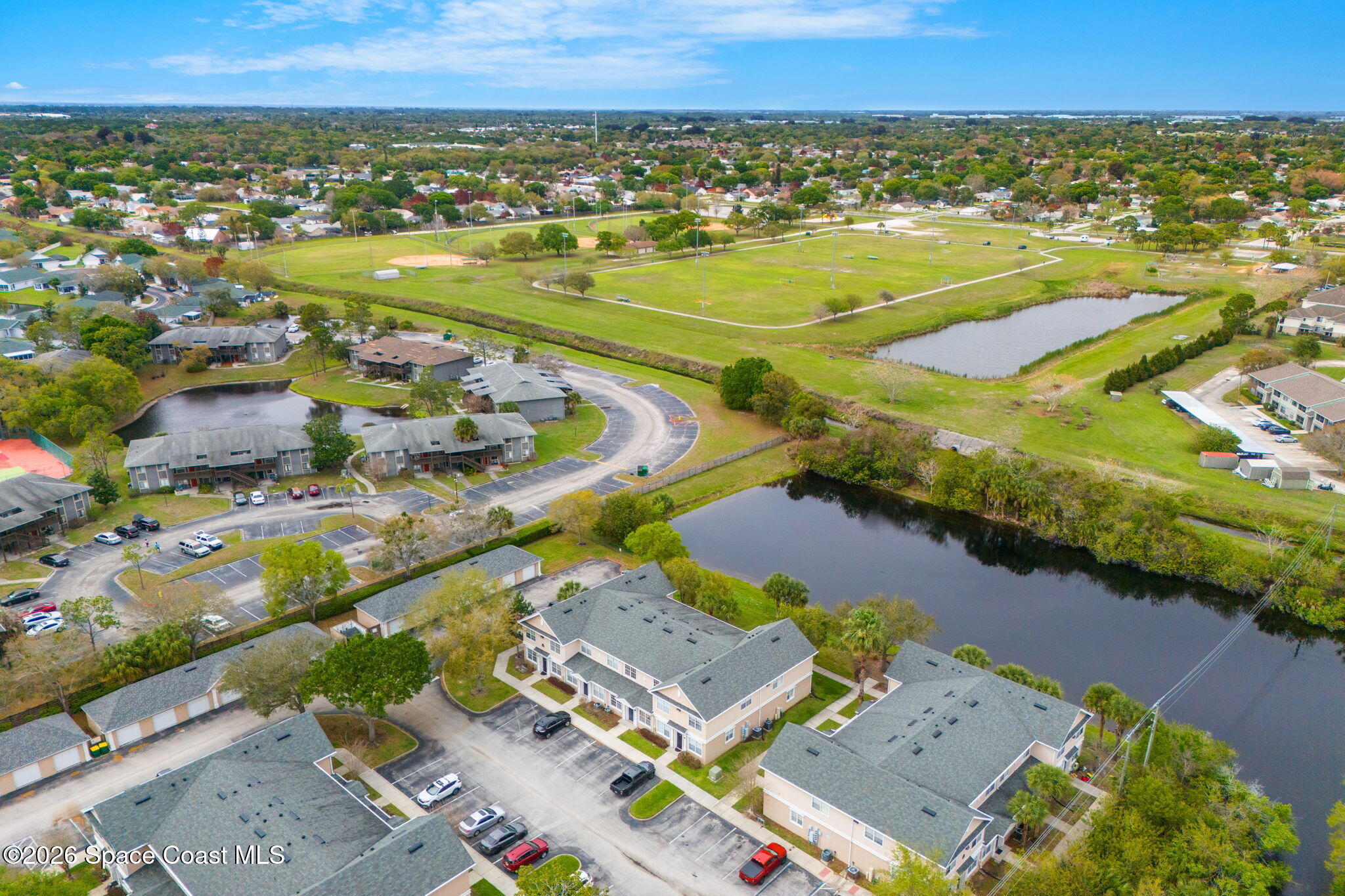 110 Turpial Way, Unit 102 Melbourne, FL 32901 - Photo 17 of 23 an aerial view of residential houses with outdoor space