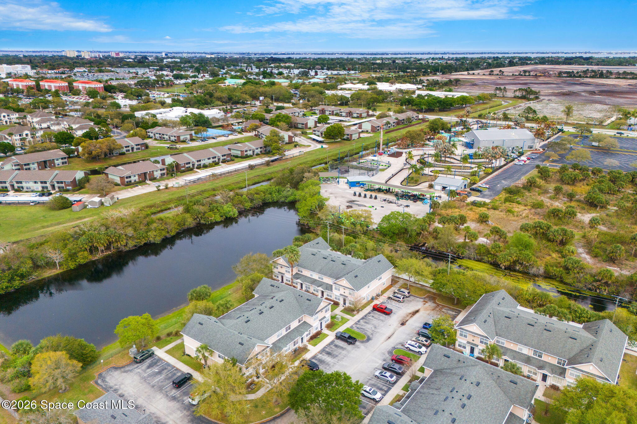 110 Turpial Way, Unit 102 Melbourne, FL 32901 - Photo 18 of 23 an aerial view of residential houses with outdoor space