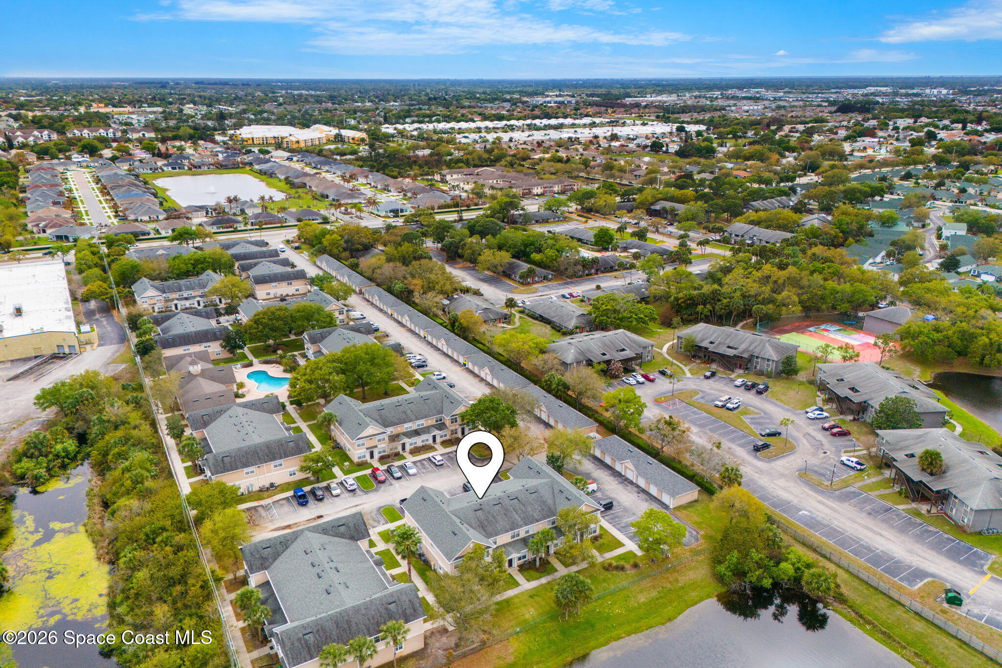 110 Turpial Way, Unit 102 Melbourne, FL 32901 - Photo 21 of 23 an aerial view of residential houses with outdoor space