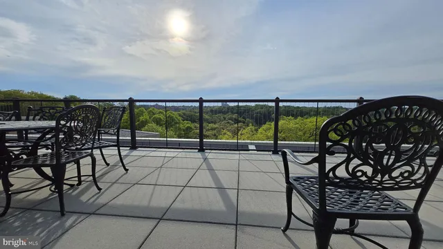 a view of a chairs and table in patio