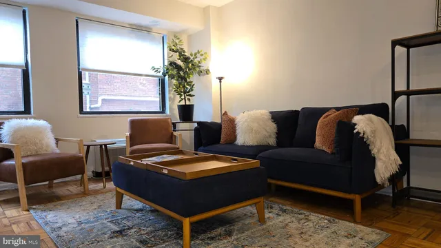a living room with furniture and a window