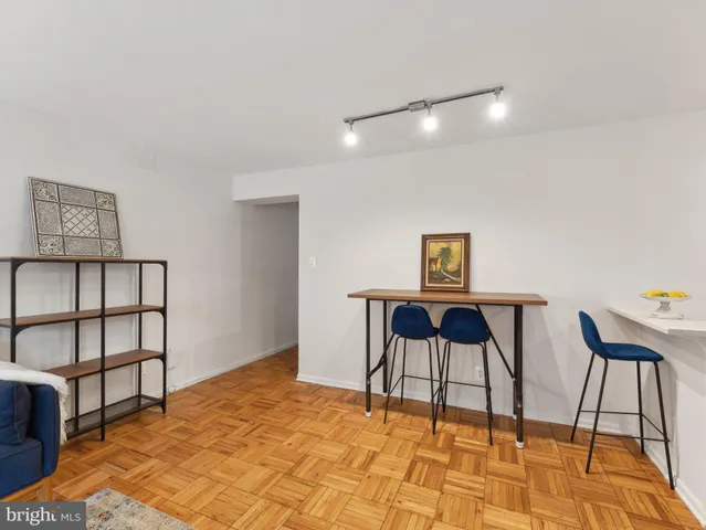 a bedroom with a bed and a chair