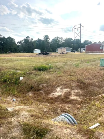 a view of a field with an ocean view
