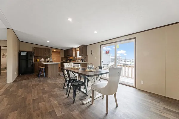 a view of a dining room with furniture and a livingroom