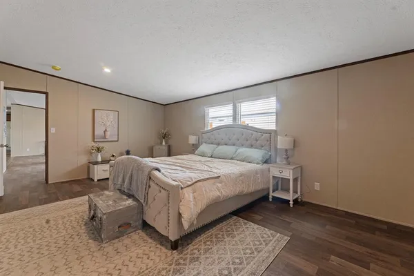 a bedroom with a bed and a couch