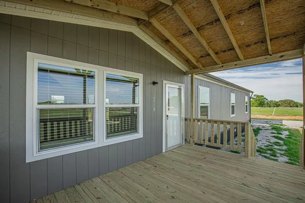 a view of backyard with deck