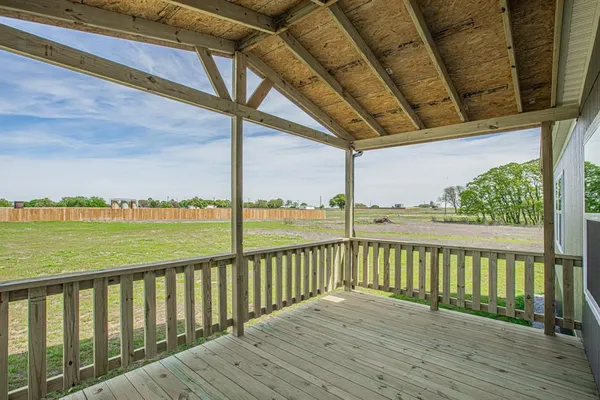 a view of balcony with wooden floor