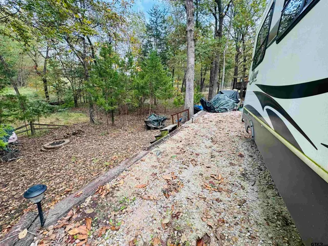 a pathway of a house with a yard