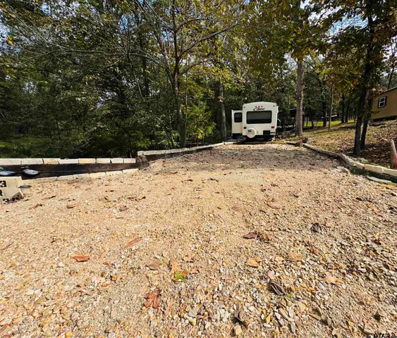 a view of a backyard of the house