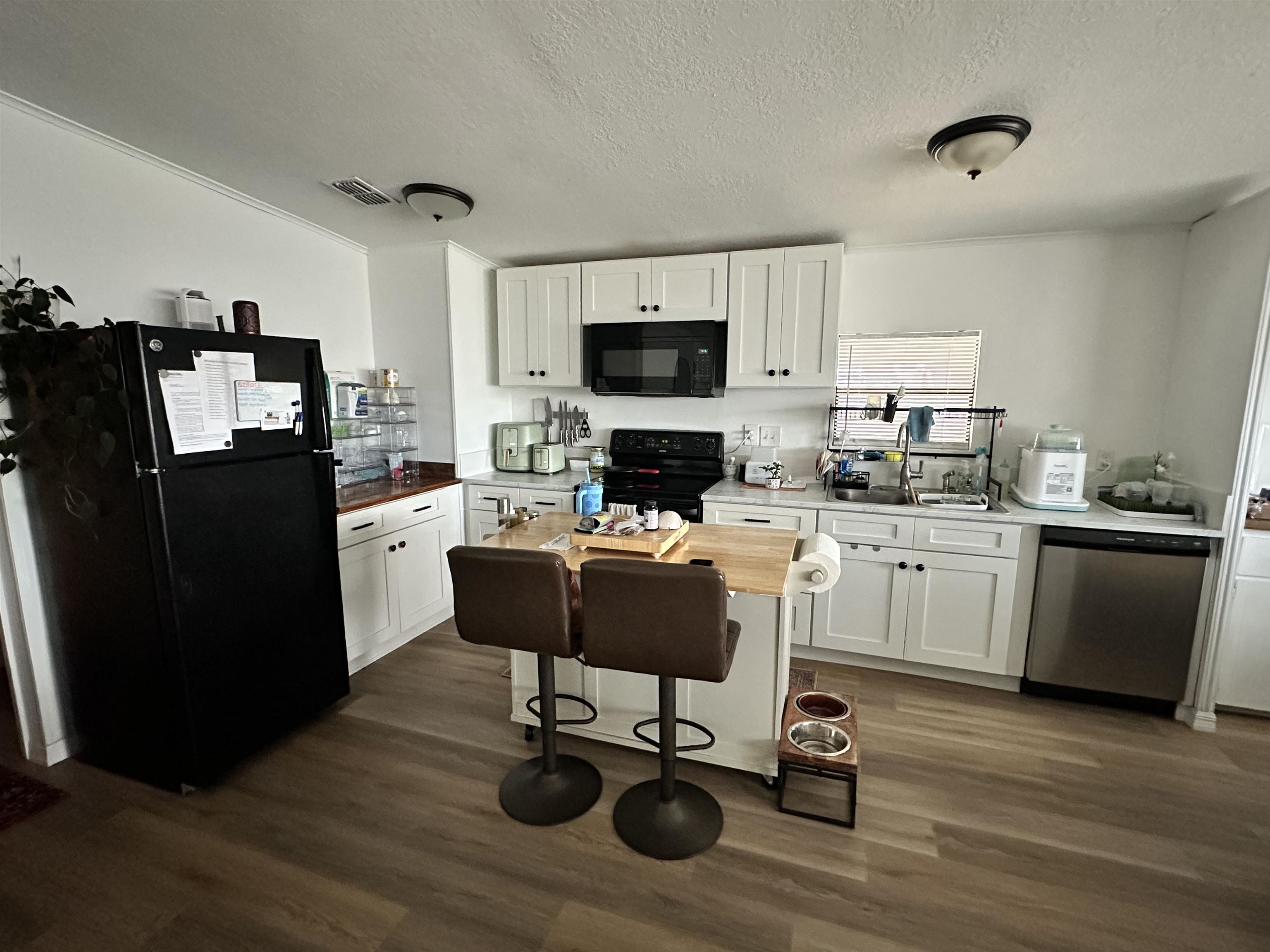 272 Pizarro Road St. Augustine, FL 32080 - Photo 16 of 23 a kitchen with a refrigerator cabinets and wooden floor