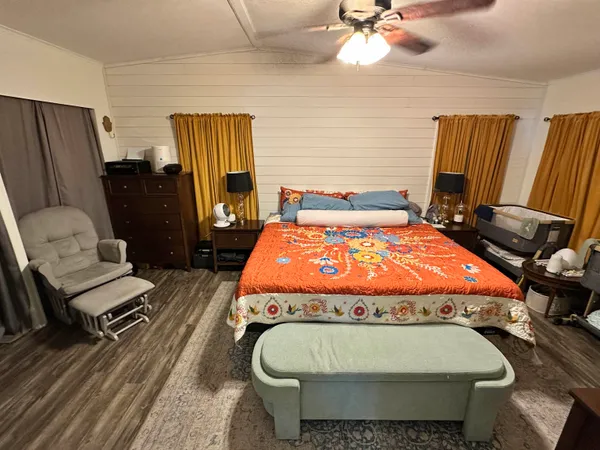 a room with sink mirror and furniture