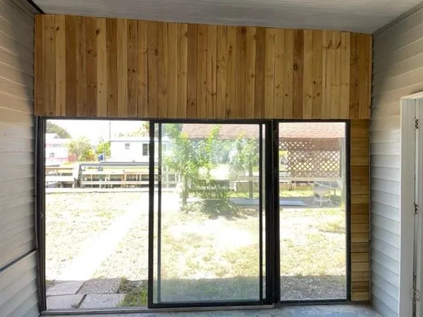 a view of a porch with a door back yard