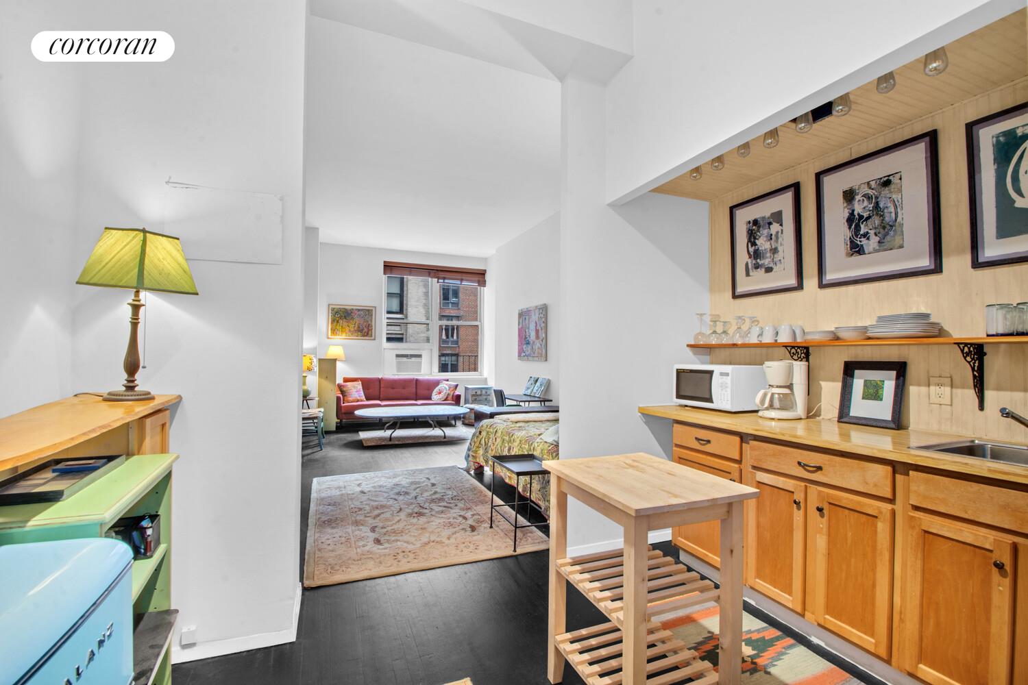 23 Waverly Place, Unit 4W Manhattan, NY 10003 - Photo 4 of 7 a living room with furniture