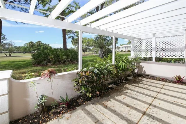front view of a house that has a flower plants