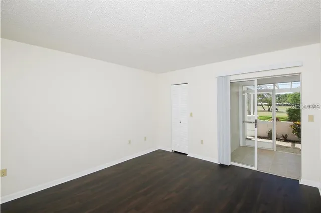 a view of an empty room with a stove