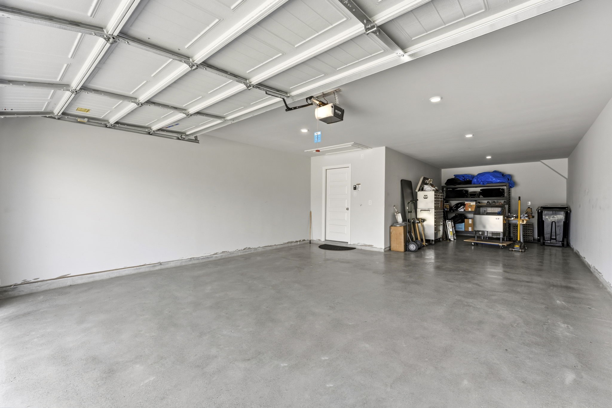 15618 Turtlehead Trail Conroe, TX 77302 - Photo 8 of 50 3 Car Tandem Garage with Polished Concrete flooring. The Spacious Garage has recessed LED Lighting and will accommodate 1/2 or 3/4 Ton pickup plus mid-sized SUV and still have room for storage. Lots of possibilites! It also has natural light with 2 windows above garage door. MY Q Garage Door Opener is also another plus!
