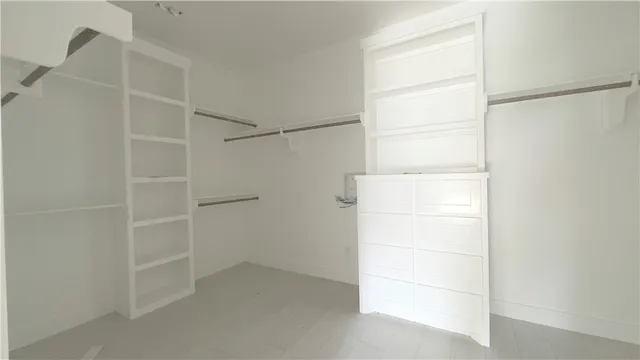 a view of an empty walk in closet