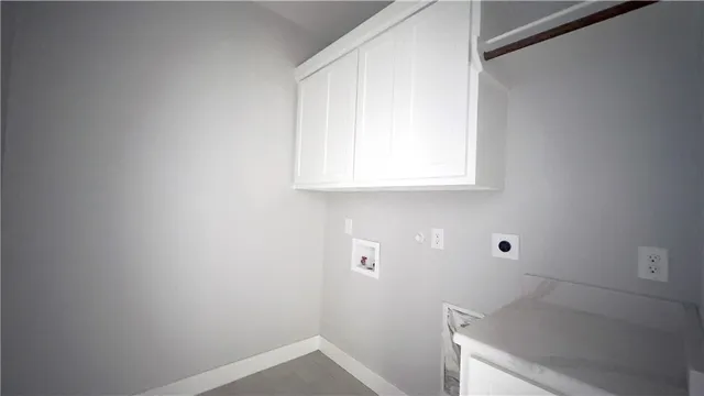 a bathroom with a sink and cabinets