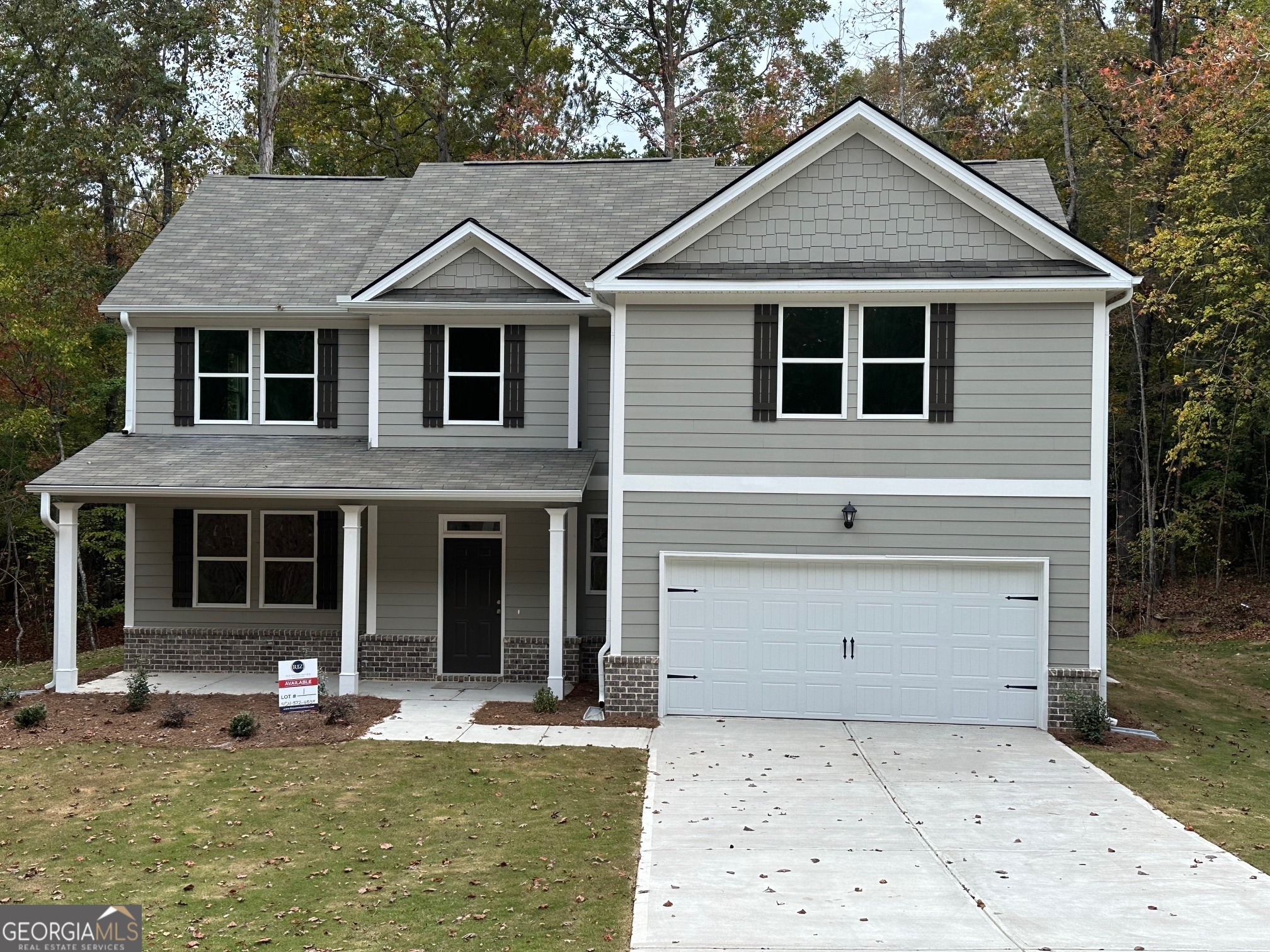 1102 Campbell Road Covington, GA 30014 - Photo 1 of 1 a front view of a house with a yard and garage