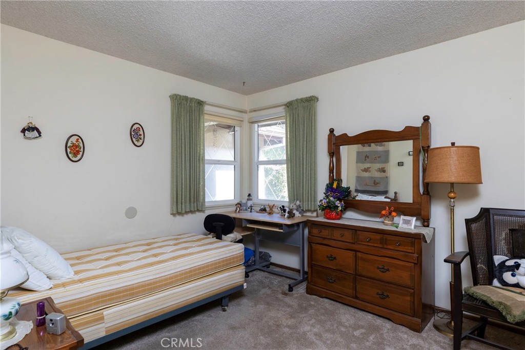 1085 Tamarack Avenue Brea, CA 92821 - Photo 15 of 28 a bedroom with furniture and a window